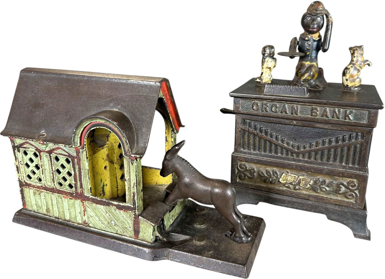 MULE ENTERING W/ ORGAN MECHANICAL BANK: 399. MULE ENTERING W/ ORGAN MECHANICAL BANK | J&E Stevens Co. & Kyser & Rex Mfg. | 8.5" l. | Mule is missing tail and two cracks on bank with custom sealed trap, Organ missing trap and rear half of