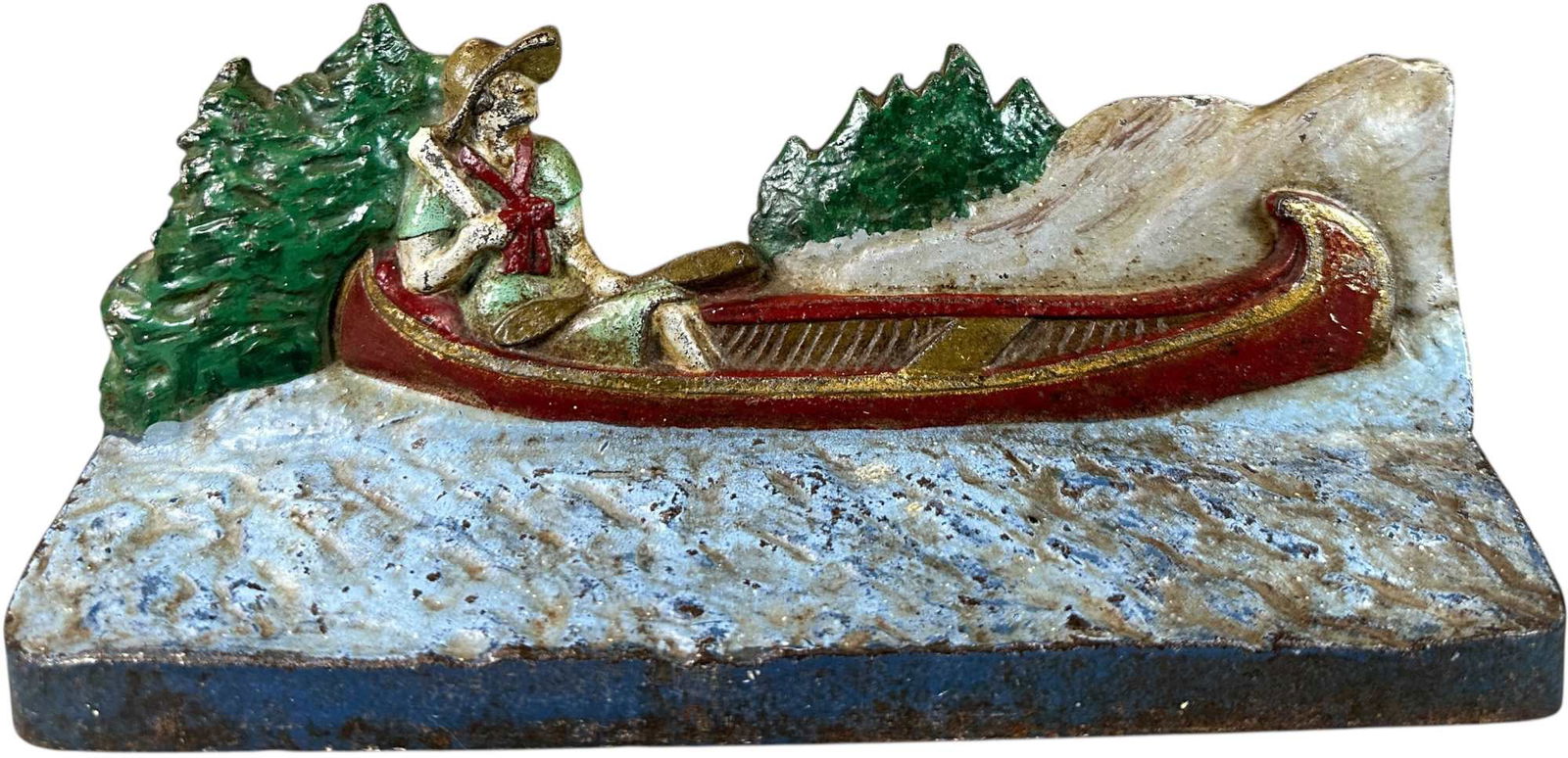 NATIONAL FOUNDRY LADY IN CANOE DOORSTOP: 403. NATIONAL FOUNDRY LADY IN CANOE DOORSTOP | 10.5" l. | (Excellent Condition) | $200 - $400