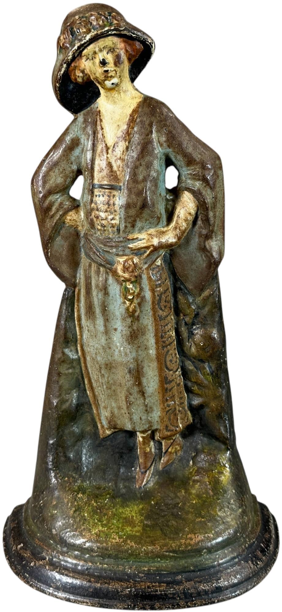 F&M CO. FLAPPER GIRL DOORSTOP: 415. F&M CO. FLAPPER GIRL DOORSTOP | 12" h. | (Very Good to Excellent Condition) | $300 - $400