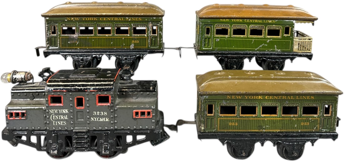BING NEW YORK CENTRAL PASSENGER TRAIN SET: 1. BING NEW YORK CENTRAL PASSENGER TRAIN SET | O gauge, electric, hand painted loco with litho cars. | 6" l. loco | (Excellent Condition) | $300 - $500