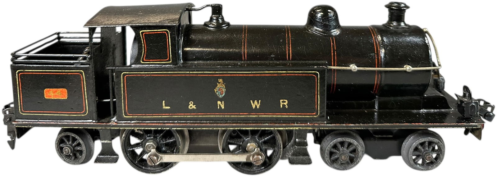 MARKLIN L&NWR PRECURSOR TANK LOCOMOTIVE: 4. MARKLIN L&NWR PRECURSOR TANK LOCOMOTIVE | O gauge, clockwork, hand painted. | 10.5" l. loco | (Excellent to Pristine Condition) | $1,000 - $2,000