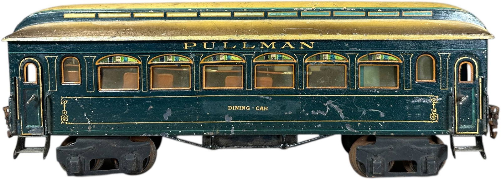 DELUXE MARKLIN PULLMAN DINING CAR: 9. DELUXE MARKLIN PULLMAN DINING CAR | Gauge 1, hand painted with filigree on interior roof and gold lining on exterior, has detailed interior. | 14.5" l. | Old label over one letterboard, (Very Good