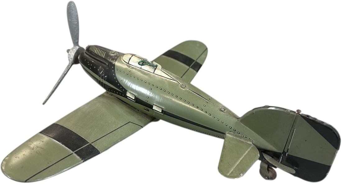 TIPPCO MONOCOUPE FIGHTER: 21. TIPPCO MONOCOUPE FIGHTER | Prewar tinplate with working wind-up replacement propeller. | 10" wingspan | (Excellent Condition) | $250 - $500