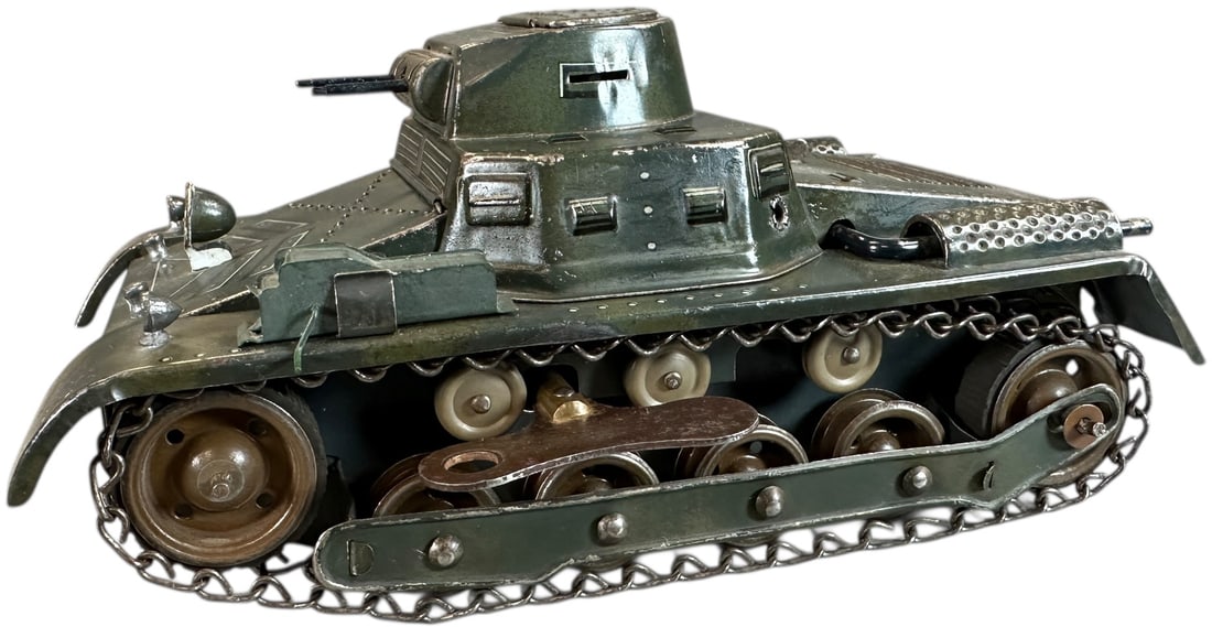 TIPPCO TINPLATE TANK: 24. TIPPCO TINPLATE TANK | Prewar working clockwork tank with chain drive. | 9" l. | (Excellent Condition) | $300 - $500