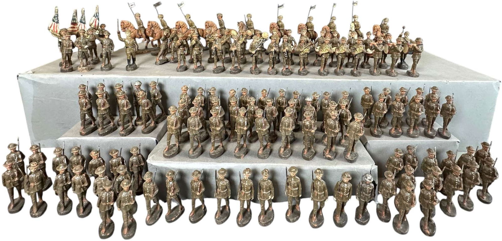 LARGE LOT OF ELASTOLIN DOUGH BOY FIGURES: 30. LARGE LOT OF ELASTOLIN DOUGH BOY FIGURES | Composition, this set was on display for decades in the national guard armory in Staten Island NY. It is an impressive parade processional with mounted C