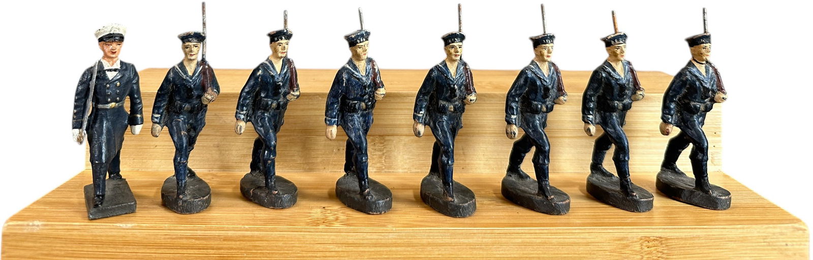 HAUSSER ELASTOLIN MARCHING SAILORS: 38. HAUSSER ELASTOLIN MARCHING SAILORS | Seven marching sailors led by a Lineol officer. From the Italian collection of Steno Tonelli. | 74 mm | (Excellent Condition) | $150 - $300