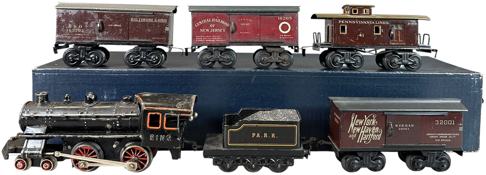 BING AMERICAN MARKET FREIGHT TRAIN SET: 43. BING AMERICAN MARKET FREIGHT TRAIN SET | O gauge, wind-up. | 9.5" l. loco | Original cars, locomotive has replaced pilot wheels and some paint touch-ups, (Very Good to Excellent Condition) | $300