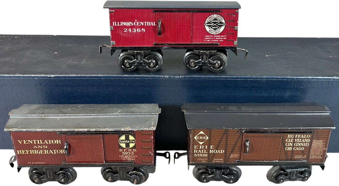 THREE BING AMERICAN MARKET BOX CARS: 44. THREE BING AMERICAN MARKET BOX CARS | O gauge. | 7" l. | Some lacquer clear coat to some lithography, (Excellent Condition) | $300 - $600
