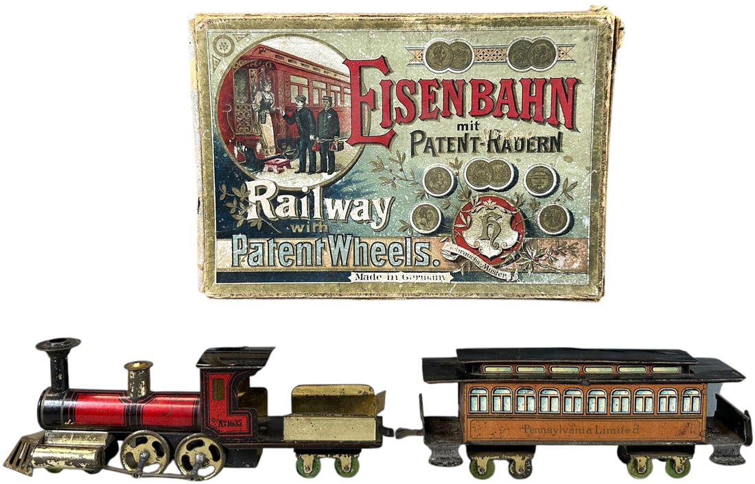 BOXED HESS PENNSYLVANIA PASSENGER TRAIN SET: 49. BOXED HESS PENNSYLVANIA PASSENGER TRAIN SET | Provenance: The Chuck Ehlers Hess Collection. | 8" l. | All original though the tender is missing paper label sides, box has some tears and missing on