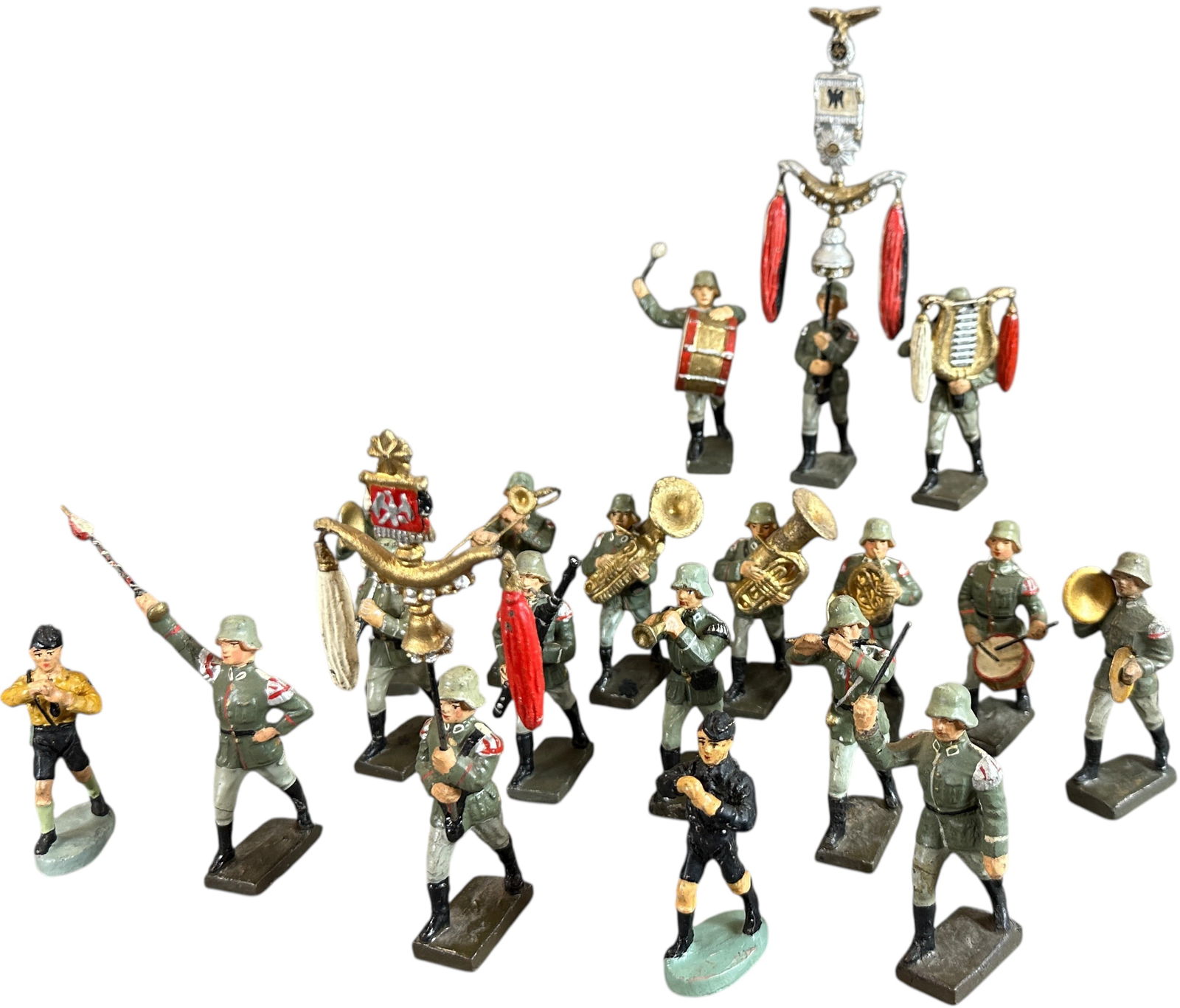 LINEOL MARCHING MUSICIANS: 67. LINEOL MARCHING MUSICIANS | Eighteen figures to include musicians, band leaders, two soldiers carrying schellenbaums and two marching Hitler Youth missing instruments. From the Italian collection