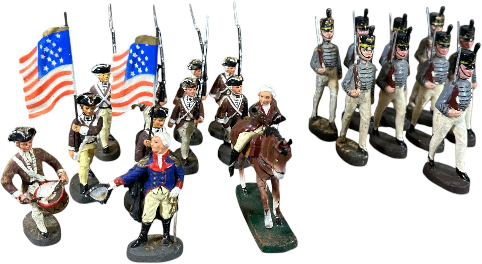 TWO SETS OF ELASTOLIN MARCHING SOLDIERS: 68. TWO SETS OF ELASTOLIN MARCHING SOLDIERS | Includes 10cm cadets and 75mm American Revolutionary War figures. | 4.5" h. gray uniform | (Excellent Condition) | $150 - $300