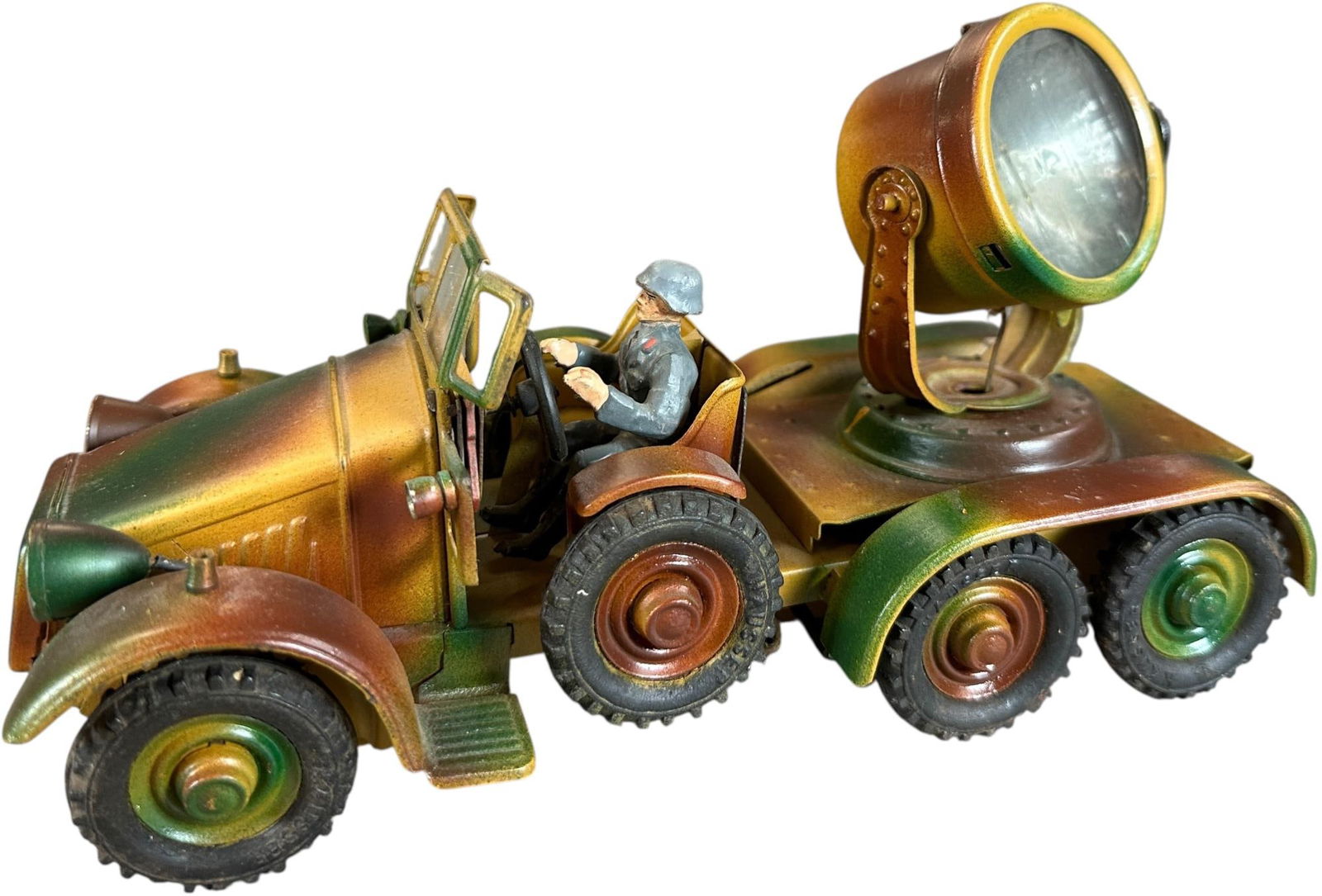 HAUSSER KRUPP SEARCHLIGHT TRUCK: 70. HAUSSER KRUPP SEARCHLIGHT TRUCK | Early version Krupp with heavy camouflage paint, come with Luftwaffe driver, clockwork motor working. From the Italian collection of Steno Tonelli. | 9 " l. | Mis