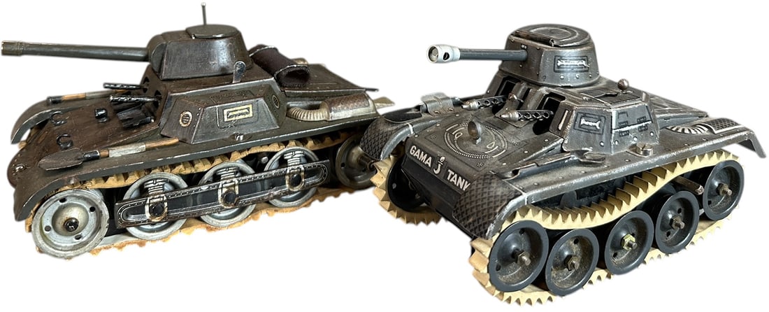GESCHE & GAMA ARMY TANKS: 80. GESCHE & GAMA ARMY TANKS | Two lithographed tin plate wind up tanks both have working motors. From the Italian collection of Steno Tonelli. | Largest 7.25 "l. | Original treads stretched otherwise
