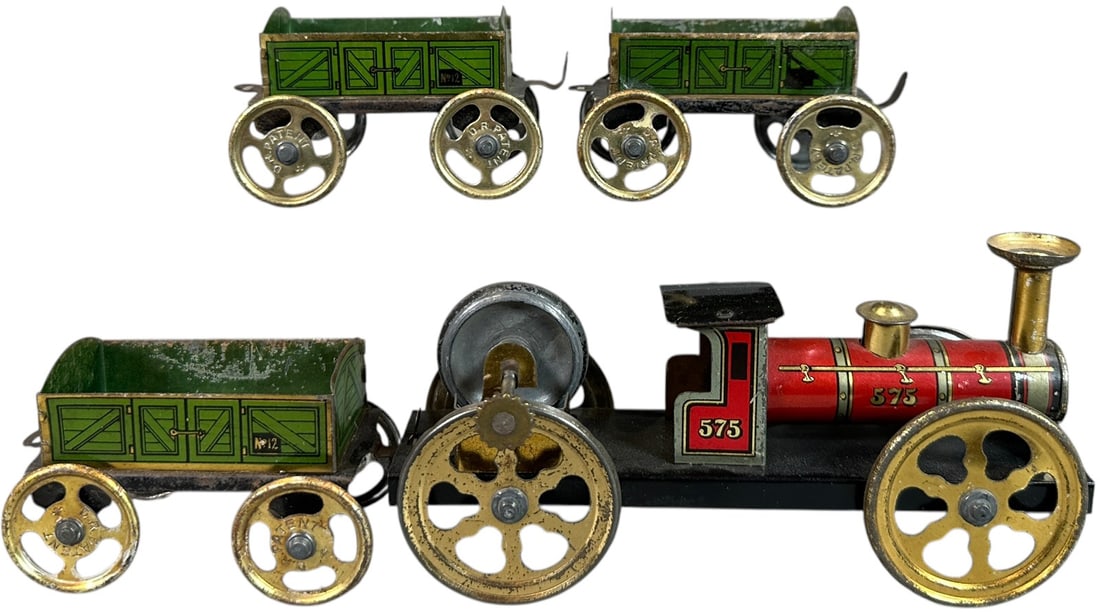 FLYWHEEL LOCOMOTIVE W/ ISSMAYER GONDOLAS: 93. FLYWHEEL LOCOMOTIVE W/ ISSMAYER GONDOLAS | Provenance: The Chuck Ehlers Hess Collection. | 6.5" l. loco | Black frame of loco is enhanced, overall (Very Good Condition) | $200 - $400