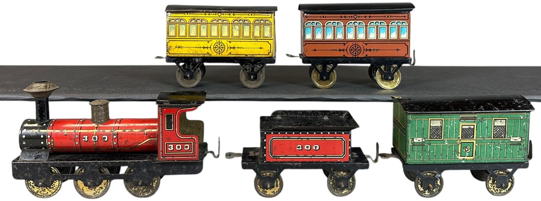 COLORFUL HESS PASSENGER TRAIN: 100. COLORFUL HESS PASSENGER TRAIN | Provenance: The Chuck Ehlers Hess Collection. | 6" l. loco | One car roof replaced, otherwise (Excellent Condition) | $300 - $600