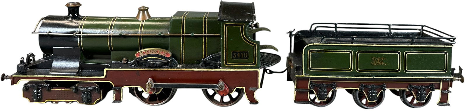 BING SYDNEY LOCOMOTIVE: 124. BING SYDNEY LOCOMOTIVE | Gauge 1, clockwork, hand painted. | 12.5" l. loco | Tender railing is added, some professional enhancements with lacquering applied, displays as (Excellent Condition) | $