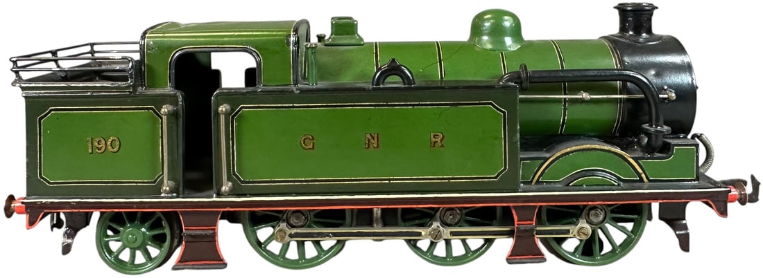 BING FOR B.LOWKE ELECTRIC 0-6-2 TANK LOCO: 125. BING FOR B.LOWKE ELECTRIC 0-6-2 TANK LOCO | Gauge 1, clockwork, hand painted. Ex: The Tony Cuff UK Collection. | 13.5" l. loco | Minor denting to roof, professional paint enhancement is blended n