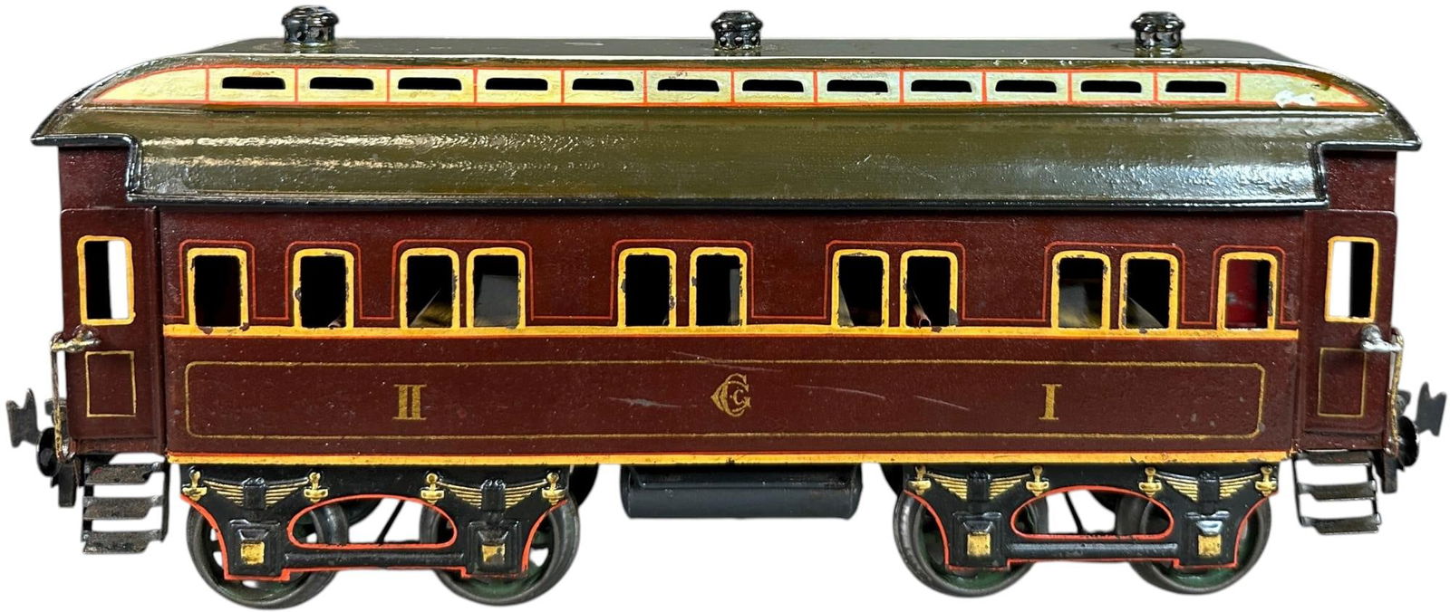 CARETTE GAUGE 2 PASSENGER CAR: 131. CARETTE GAUGE 2 PASSENGER CAR | Gauge 2, hand painted. | 12.5" l. | Roof is original though the top surface has been repainted, otherwise (Excellent Condition) | $500 - $1,000