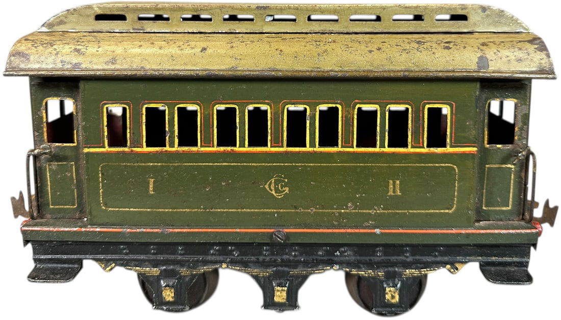 RARE CARETTE GAUGE 3 PASSENGER CAR: 133. RARE CARETTE GAUGE 3 PASSENGER CAR | Gauge 3 (67mm), hand painted. | 10" l. loco | Clerestory on roof is loose, missing one pair of wheels, otherwise (Very Good to Excellent Condition) | $800 - $