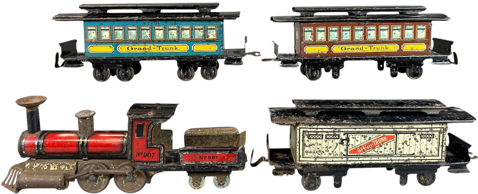 RARE HESS GRAND TRUNK RAILWAY SET: 134. RARE HESS GRAND TRUNK RAILWAY SET | Unpowered floor train. Provenance: The Chuck Ehlers Hess Collection. | 7.5" l. Loco & tender | Cowcatcher partially chipped, some missing wheels, general oxida