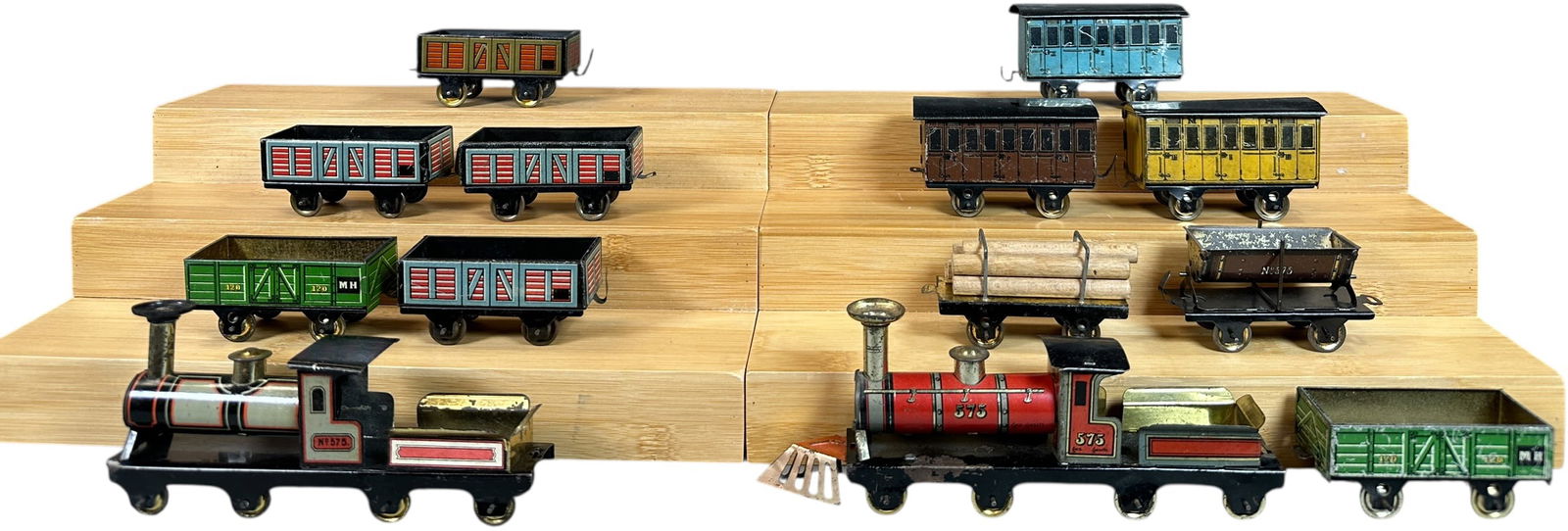 TWO HESS PENNY TOY FREIGHT TRAIN SETS: 139. TWO HESS PENNY TOY FREIGHT TRAIN SETS | Provenance: The Chuck Ehlers Hess Collection. | 7" l. loco | Grey loco in missing one label on tender side, coach roofs are enhanced, overall displays in (