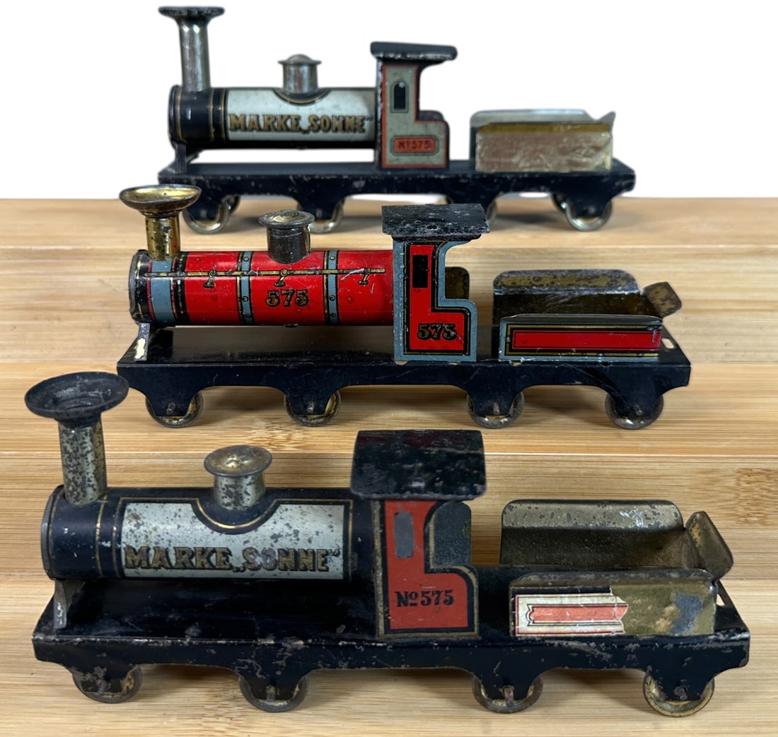 THREE HESS LOCOMOTIVES: 143. THREE HESS LOCOMOTIVES | Provenance: The Chuck Ehlers Hess Collection. | 6" l. loco | One tender missing side labels, one tender has side label torn, (Very Good Condition) | $250 - $500