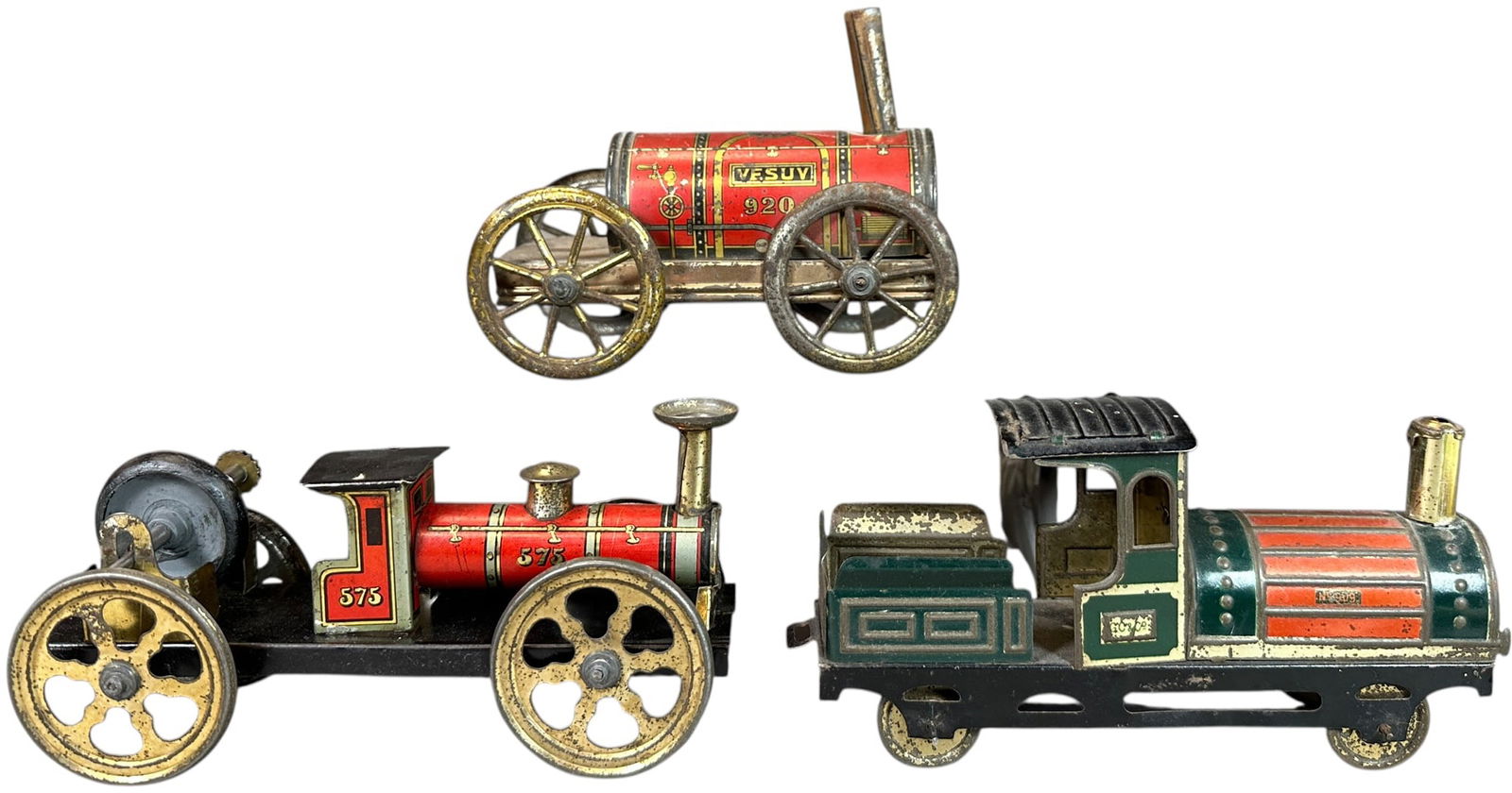 HESS & ISSMAYER LOCOMOTIVES: 155. HESS & ISSMAYER LOCOMOTIVES | Provenance: The Chuck Ehlers Hess Collection. | 6.5" l. | Gyro wheel is overpainted black, otherwise trains are original in (Very Good to Excellent Condition) | $200