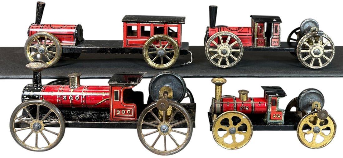 HESS FLYWHEEL LOCOMOTIVES: 156. HESS FLYWHEEL LOCOMOTIVES | Provenance: The Chuck Ehlers Hess Collection. | 9" l. | Ranging from (Very Good Condition) to (Excellent Condition) | $250 - $500