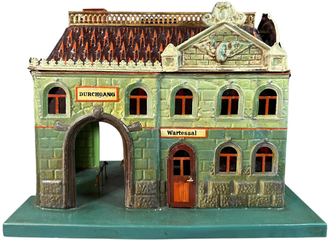 MARKLIN HAND PAINTED PASSENGER STATION: 165. MARKLIN HAND PAINTED PASSENGER STATION | Gauge 1, hand painted. Ex: The Tony Cuff UK Collection. | 13.5 8.5 x 11.5" lwh. | Station is authentic however the base is overpainted and there are some