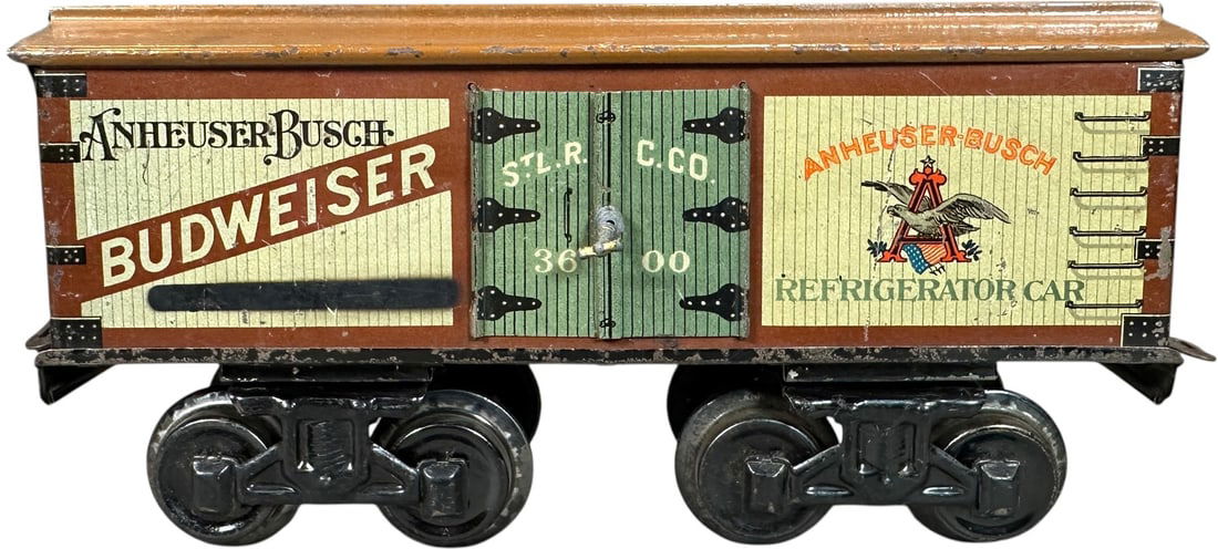 BING PROHIBITION ERA BUDWEISER BEER CAR: 180. BING PROHIBITION ERA BUDWEISER BEER CAR | Gauge 1, litho, prohibition era car with word "beer" redacted. | 9.5" l. | (Excellent Condition) | $500 - $1,000