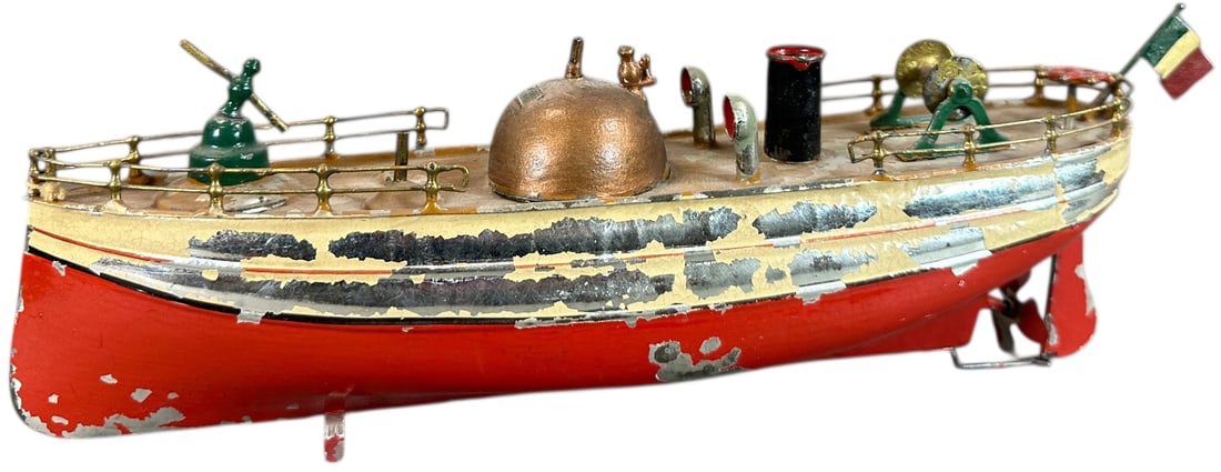 FLEISCHMANN FIRE BOAT: 199. FLEISCHMANN FIRE BOAT | No. 511, 1908 catalog. | 11.5" l. | Original paint flaked, flag is added, (Very Good Condition) | $300 - $600