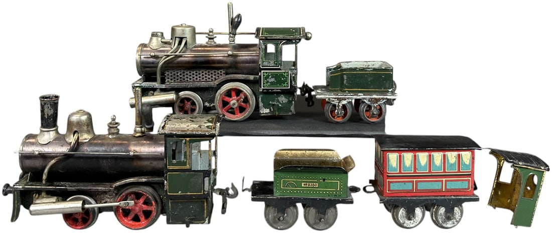 SCHOENNER LOCOMOTIVES & ISSMAYER SPARES: 207. SCHOENNER LOCOMOTIVES & ISSMAYER SPARES | O gauge, two Schoenner live steam locomotives, Issmayer litho tender, coach and spare cab. | 7" l. loco | One smokestack, cylinder, valve, and two buffer