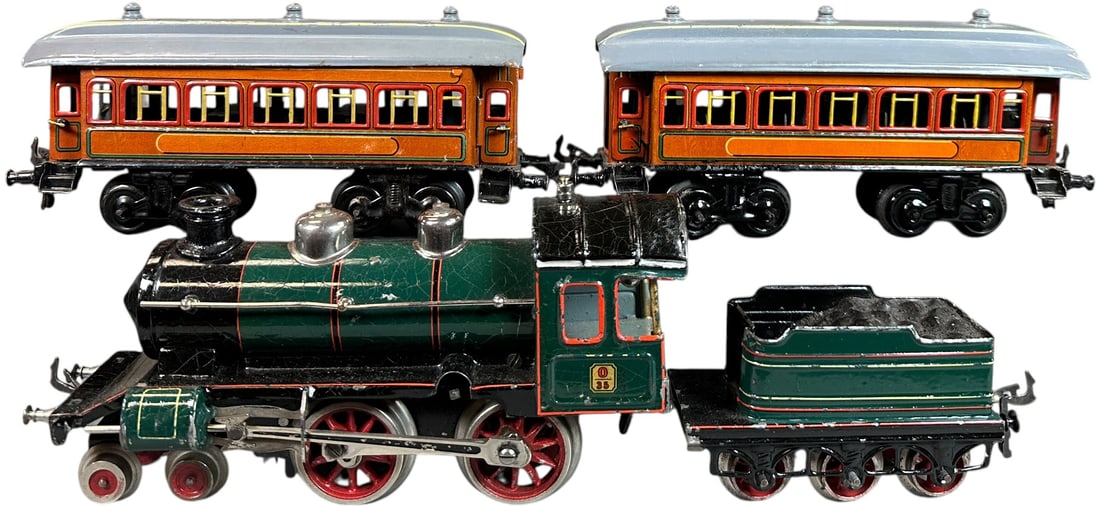 BING TEAK PASSENGER TRAIN SET: 208. BING TEAK PASSENGER TRAIN SET | O gauge, clockwork, hand painted loco with litho cars. | 8.5" l. loco | (Excellent to Pristine Condition) | $400 - $800