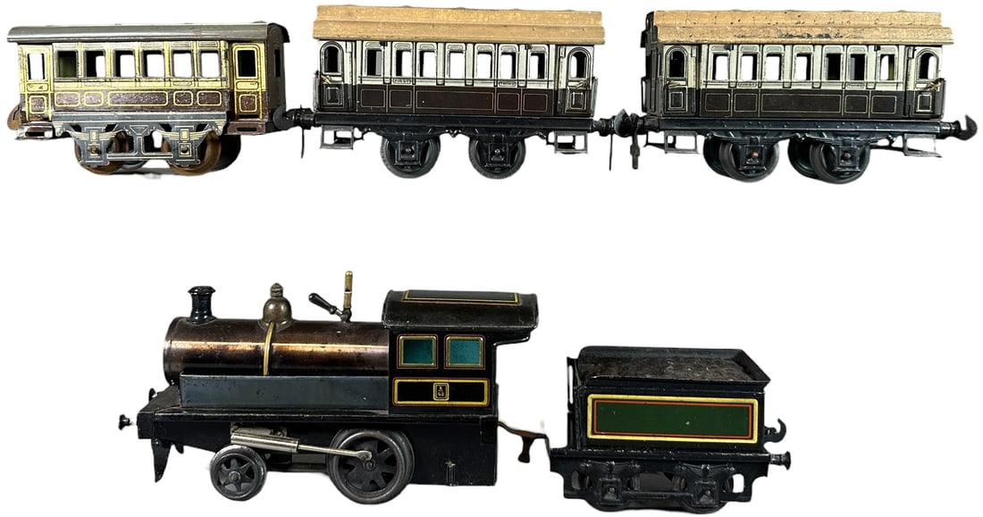 CARETTE LIVE STEAM PASSENGER TRAIN SET: 212. CARETTE LIVE STEAM PASSENGER TRAIN SET | Gauge 1, live steam, hand painted loco and tender with litho cars. | 9.5" l. loco | Some repainting to black on loco frame and sides of tender, engine and