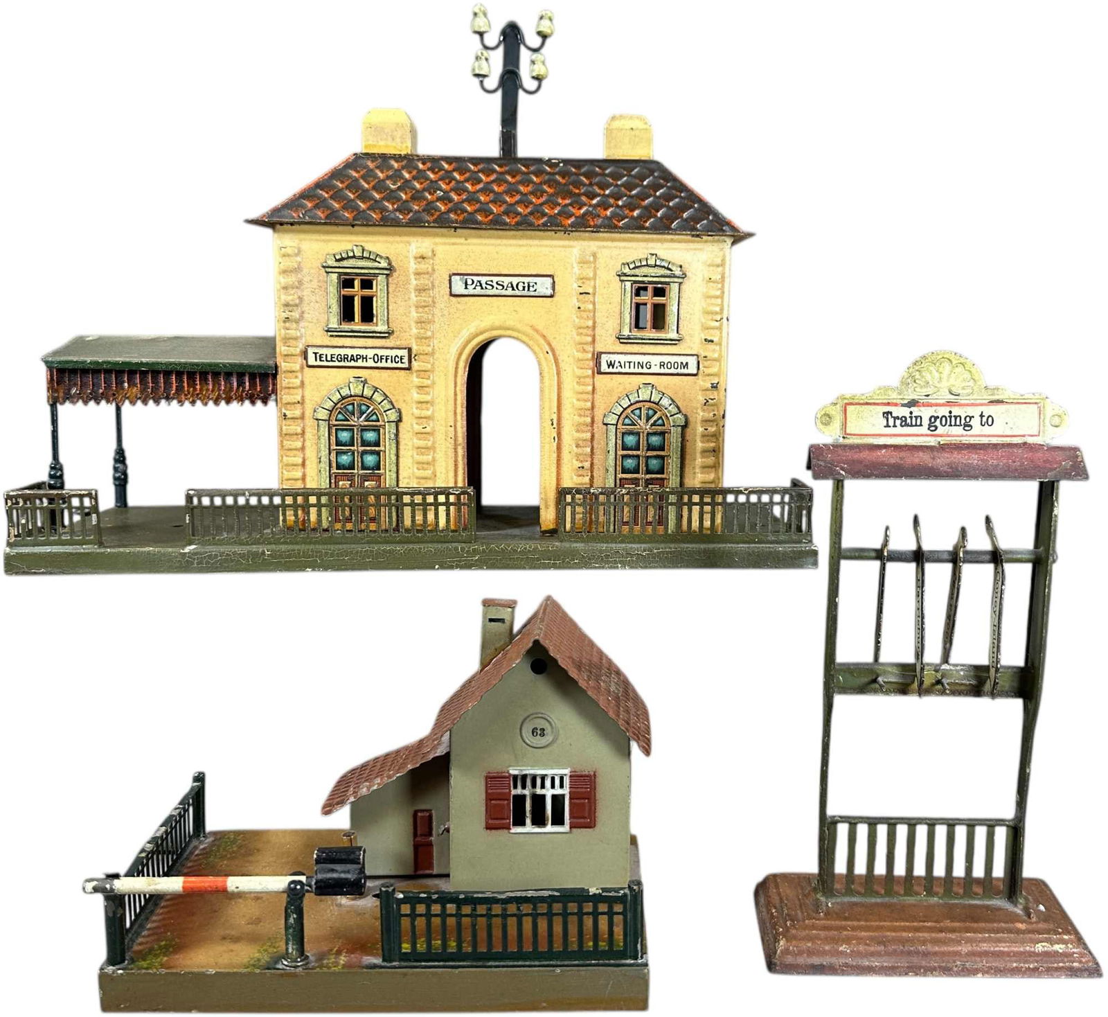 USA DESTINATION BOARD W/ STATION & GUARD HOUSE: 221. USA DESTINATION BOARD W/ STATION & GUARD HOUSE | O gauge station and guard house, destination board features US cities such as Long Island City, Coney Island, Rockaway, and Harrisburg. | 13.5 x 5
