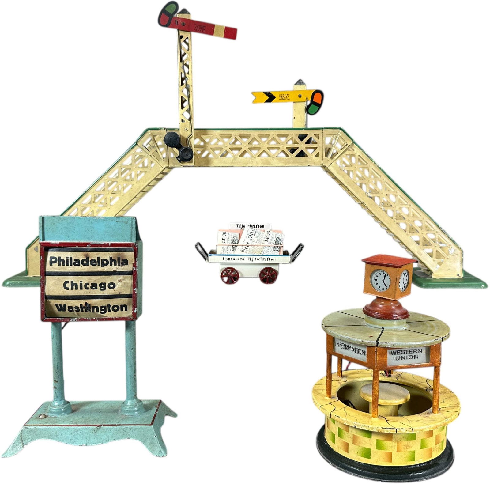 KIBRI KIOSK W/ OTHER GERMAN ACCESSORIES: 223. KIBRI KIOSK W/ OTHER GERMAN ACCESSORIES | Kibri Kiosk and newspaper cart, Ernst plank destination board and Hornby signal bridge. | 19" l. | (Very Good to Excellent Condition) | $300 - $500