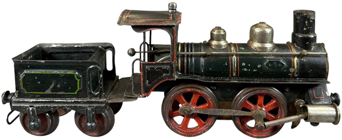 RARE MARKLIN WHISTLING CLOCKWORK LOCOMOTIVE: 225. RARE MARKLIN WHISTLING CLOCKWORK LOCOMOTIVE | Gauge 1, clockwork, hand painted, rare version with whistle device built into the cylinders. | 8" l. | Spring needs repair, (Very Good Condition) | $