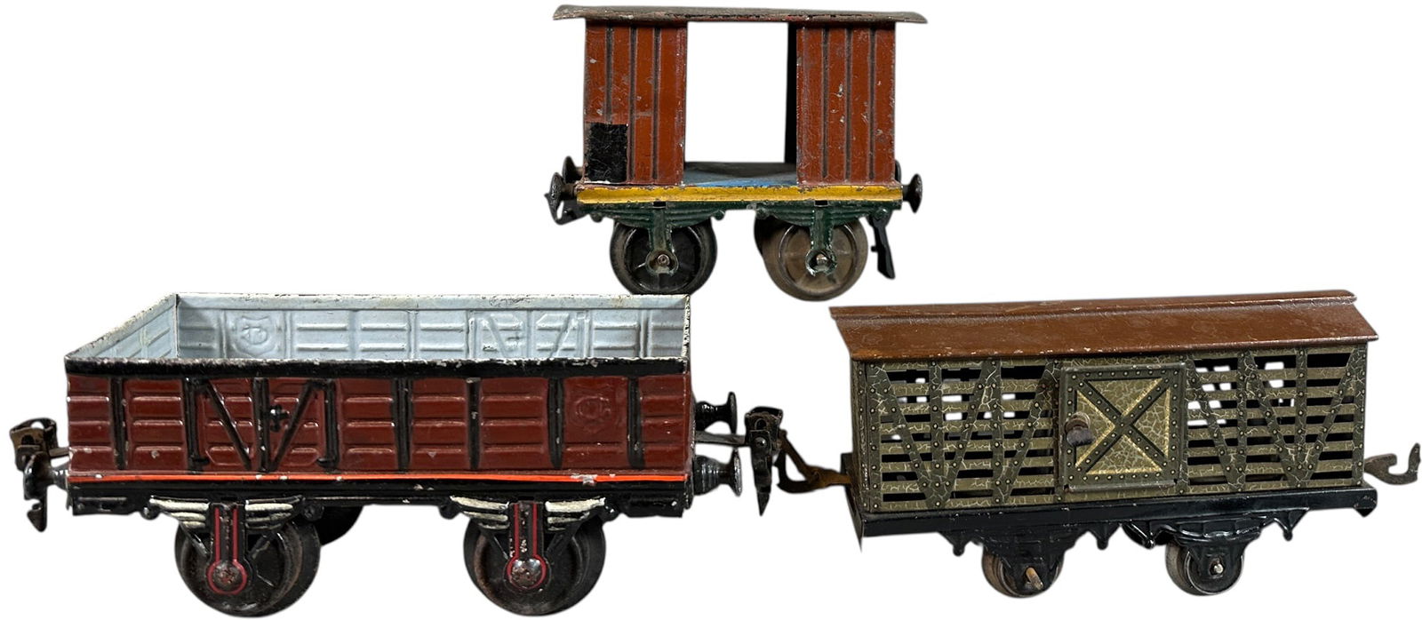 BING & MARKLIN FREIGHT CARS: 226. BING & MARKLIN FREIGHT CARS | O gauge litho Bing cattle car, two hand painted gauge 1 Marklin wagons. | 6" l. | (Very Good Condition) | $200 - $400