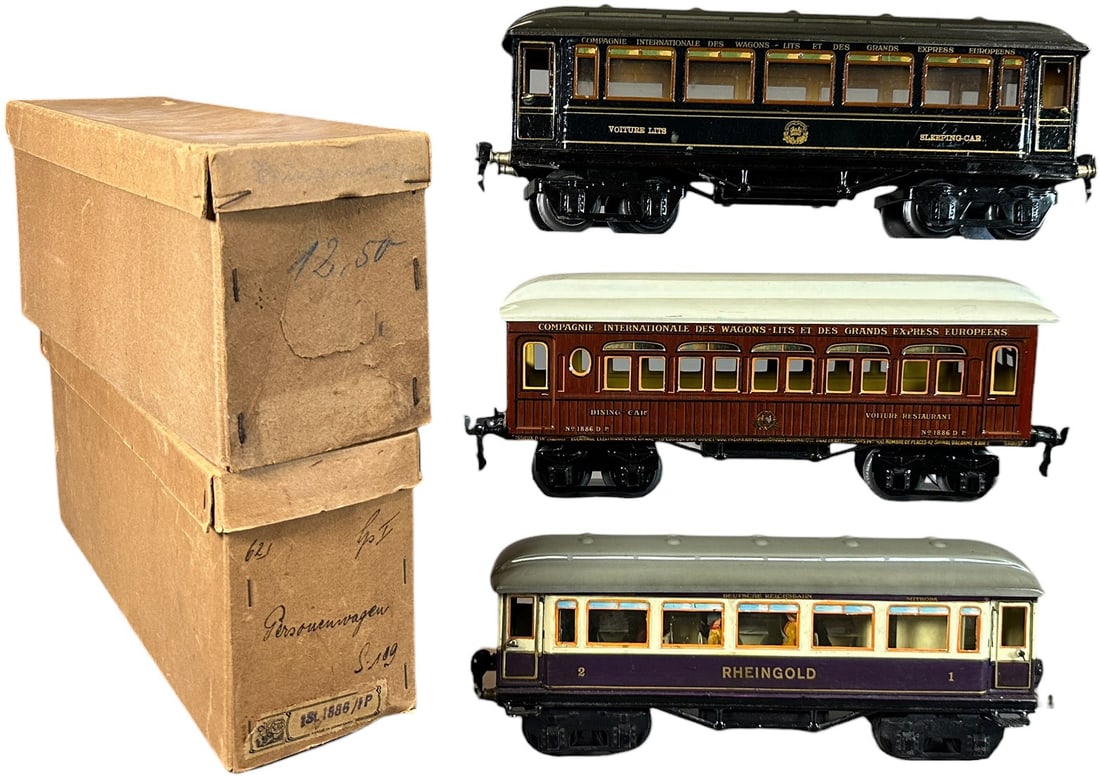 BOXED MARKLIN PASSENGER CARS: 233. BOXED MARKLIN PASSENGER CARS | Gauge 1, hand painted with detailed interiors, includes desirable Rheingold car. | 12" l. | (Pristine Condition) | $600 - $1,200