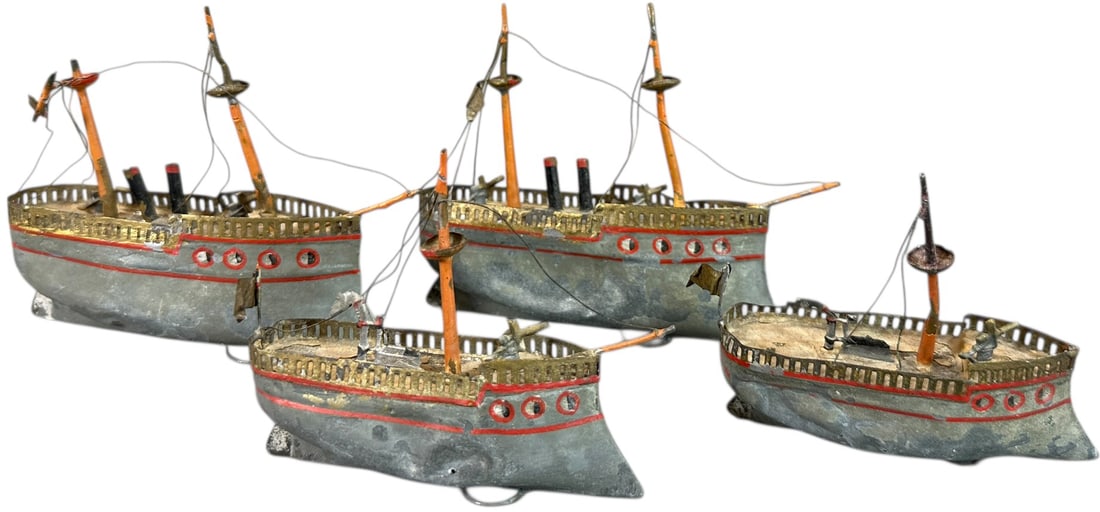 EARLY UEBELACKER TINPLATE NAVY SHIP FLOTILLA: 241. EARLY UEBELACKER TINPLATE NAVY SHIP FLOTILLA | c. 1900. | 4" l. | Age related wear and tear with minor denting, free from repairs or repaint, (Very Good Condition) | $400 - $700