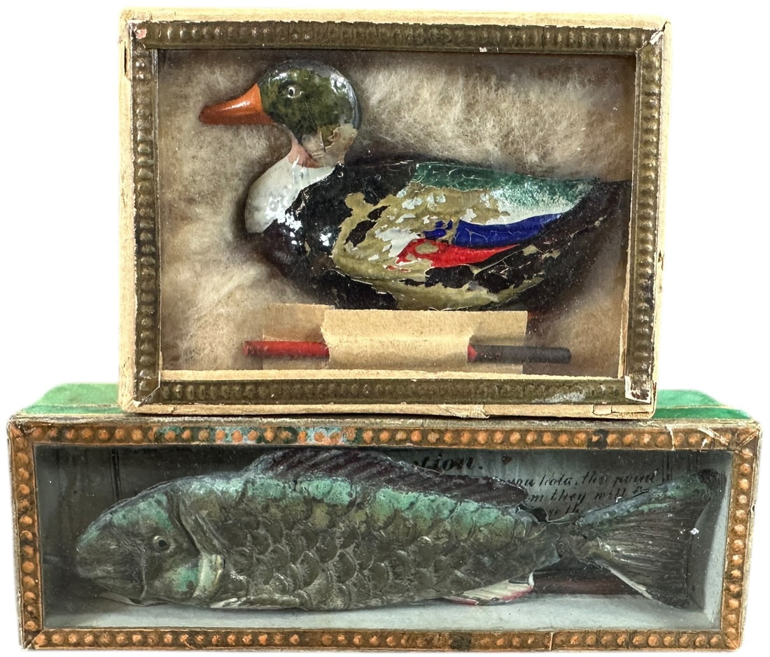 GERMAN MAGNETIC DUCK & FISH TOYS: 244. GERMAN MAGNETIC DUCK & FISH TOYS | In original boxes, c. 1900. | 4" l. | Both with magnetic poles, fish has denting but includes instruction sheet (Very Good Condition), duck is (Excellent to Pri