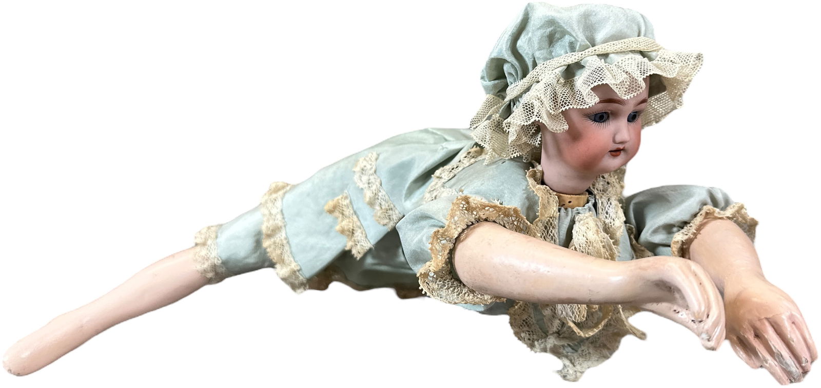 ONDINE SWIMMING MECHANICAL DOLL: 247. ONDINE SWIMMING MECHANICAL DOLL | France, wind-up motor. When wound, the arms and legs move in and out in a realistic "breast stroke-type" manner as doll swims in a forward motion, head is marked