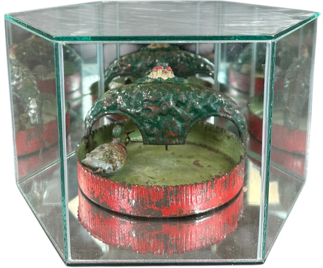 SCARCE FLEISCHMANN CLOCKWORK POND W/ DUCK: 250. SCARCE FLEISCHMANN CLOCKWORK POND W/ DUCK | 1908 catalog, with glass case. | 6" l. | All original and well preserved, includes mirrored glass display case, (Excellent Condition) for age. | $300