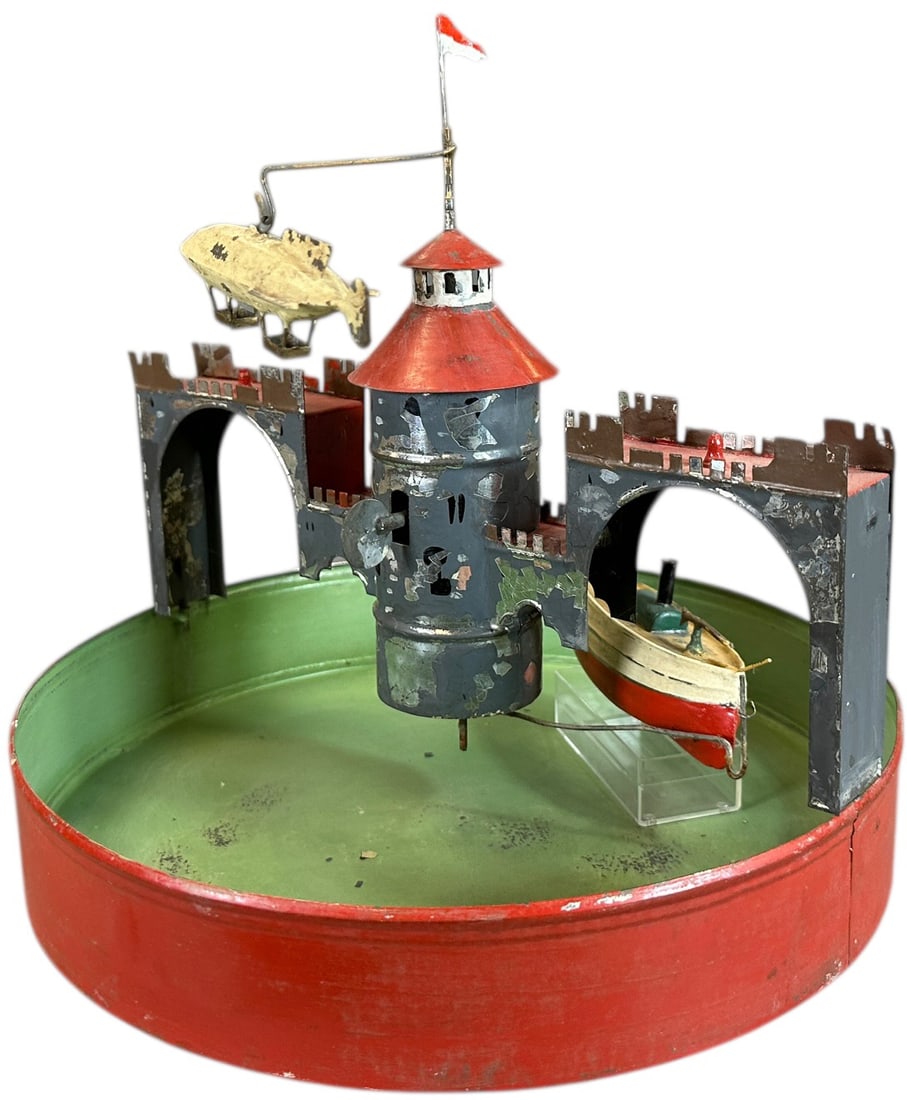 FLEISCHMANN STEAM POND W/ BOAT & AIRSHIP: 251. FLEISCHMANN STEAM POND W/ BOAT & AIRSHIP | No. 5480, 1908 catalog, scarce with airship. | 10.5" l. | Authentic dirigible, building paint is primarily original with some in-painting, base and boat