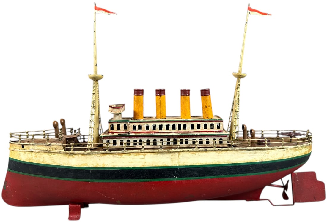 EARLY FLEISCHMANN OCEAN LINER: 259. EARLY FLEISCHMANN OCEAN LINER | Possibly made for Carette by Fleischmann, wind-up. | 19" l. | Repainted throughout and covered with a lacquer varnish, (Very Good Condition) | $600 - $1,000