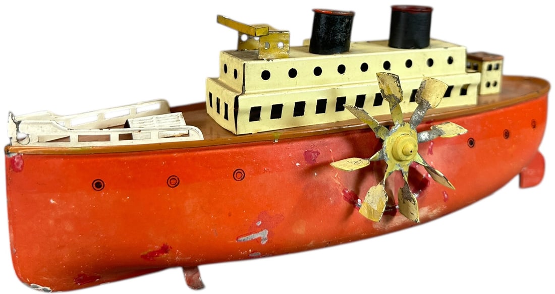 FLEISCHMANN SIDE WHEELER BOAT: 262. FLEISCHMANN SIDE WHEELER BOAT | c. 1936, No.750/24. | 9.5" l. | Minor touch-up to hull where paddle flaps scratched paint, (Very Good to Excellent Condition) | $200 - $400