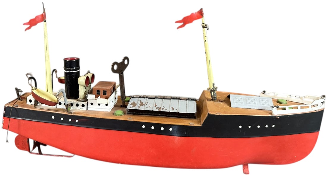 FLEISCHMANN MERCHANT BOAT: 265. FLEISCHMANN MERCHANT BOAT | Germany, wind-up motor. | 12" l. | One lifeboat hook absent/strung, otherwise (Excellent Condition) | $250 - $500