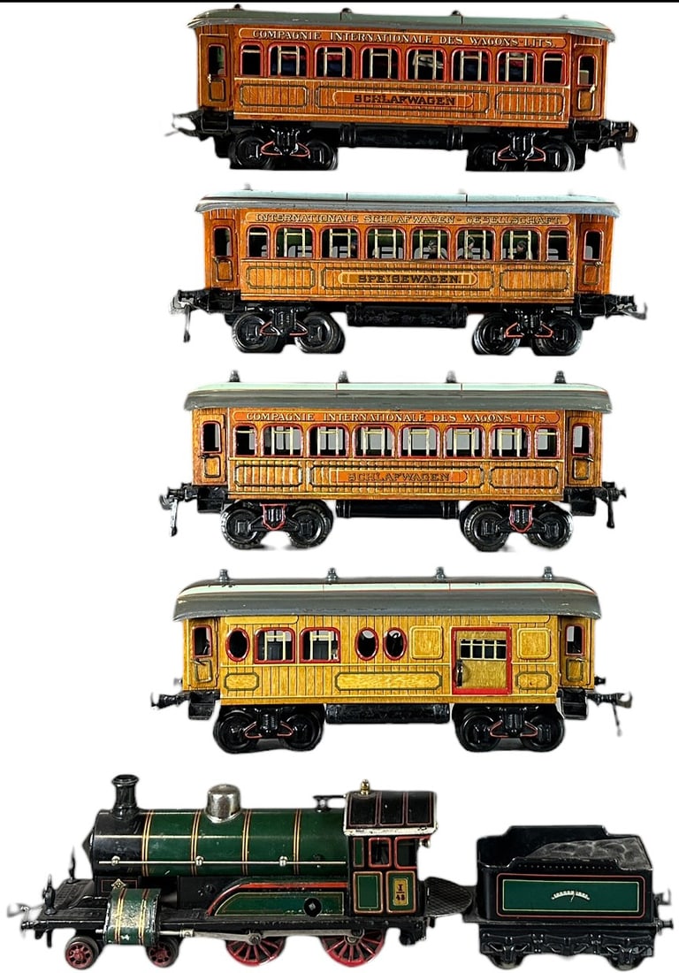 BING GAUGE 1 TEAK PASSENGER TRAIN SET: 280. BING GAUGE 1 TEAK PASSENGER TRAIN SET | Gauge 1, clockwork, litho, cars have detailed interiors. | 12" l. loco | (Excellent to Pristine Condition) | $700 - $1,400