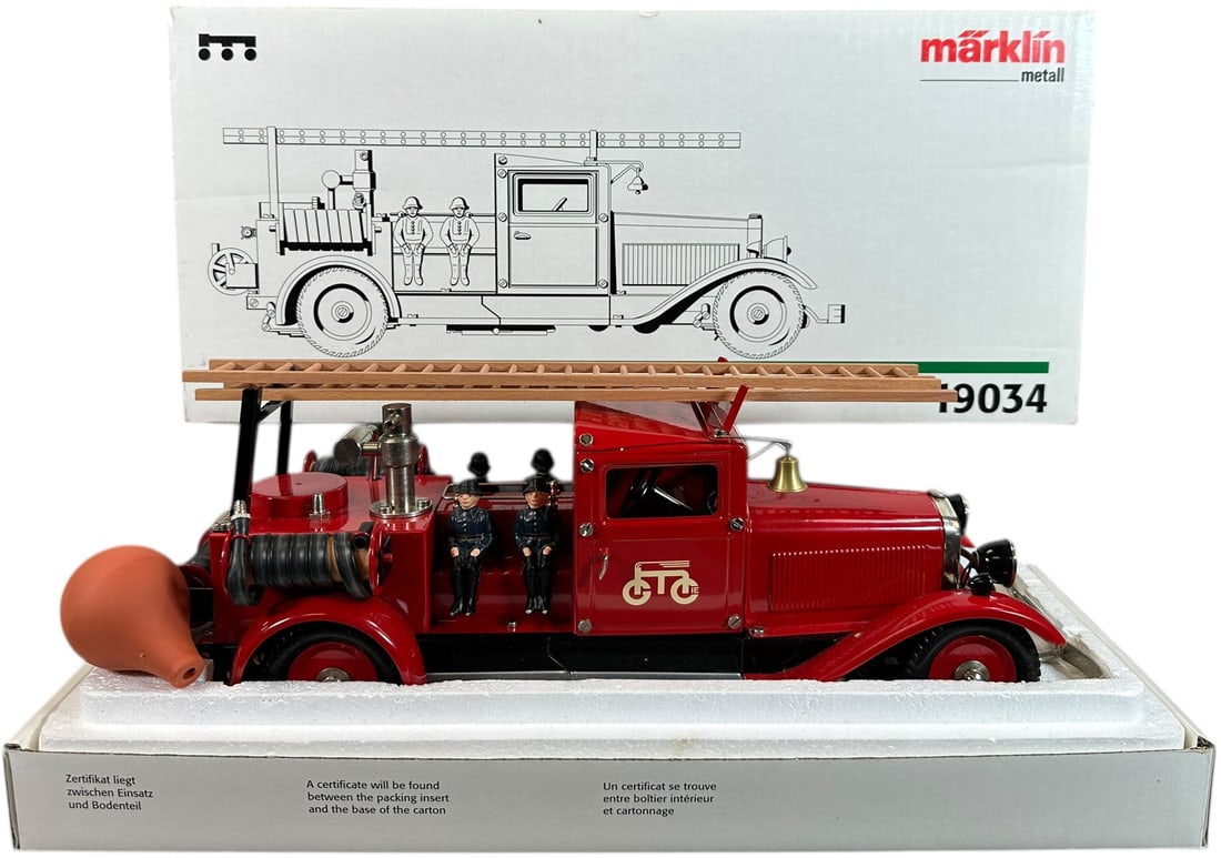 BOXED MARKLIN FIRE LADDER TRUCK #19034: 300. BOXED MARKLIN FIRE LADDER TRUCK #19034 | 14.5" l. | Authentic Marklin re-issue, (Near Mint Condition) | $200 - $400