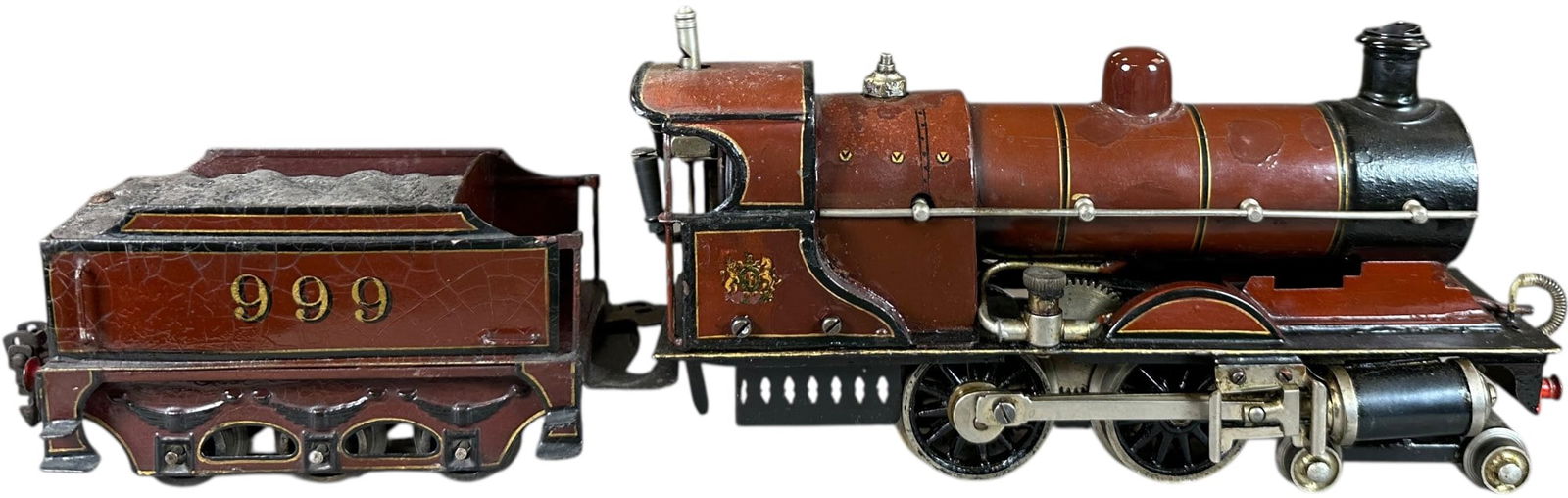 MARKLIN LIVE STEAM LMS LOCOMOTIVE: 346. MARKLIN LIVE STEAM LMS LOCOMOTIVE | O gauge, live steam, hand painted 4-4-0 with matching tender. | 9" l. loco | Cab and boiler restored and aged, displays in (Excellent Condition) | $600 - $900